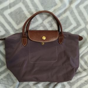 Purple Longchamp small short handles purse
